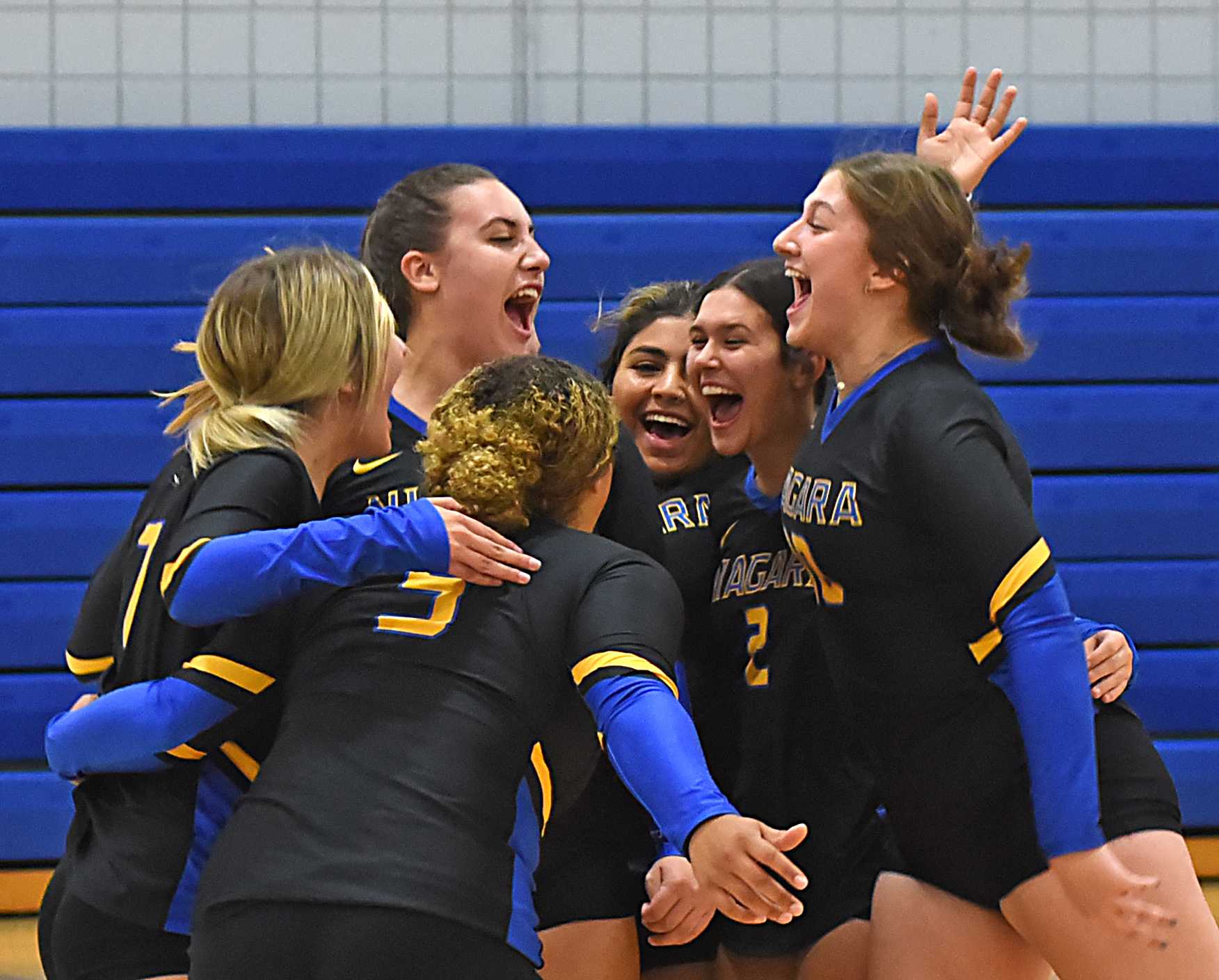 Spikers win conference opener